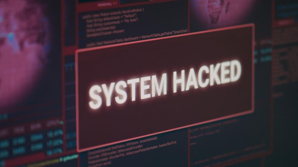 computer monitor showing hacked system alert message flashing screen dealing with hacking cyber crime attack display with security breach warning malware threat close up 1